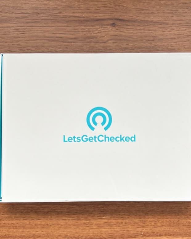 The boxed up LetsGetChecked Heart Health Test kit on a wooden surface